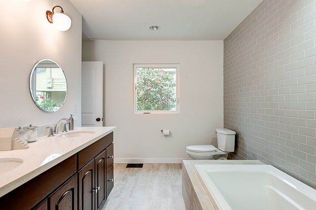 Bath with dual sinks and subway tile