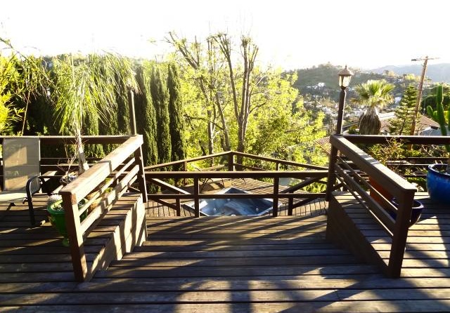 Decks with hot tub and views. Courtesy of Vladan Stojanovic – Nourmand & Assoc.