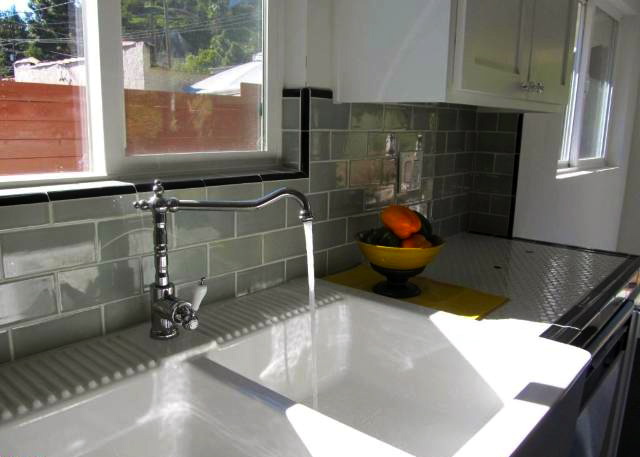Kitchen with subway tile and hex tile counters